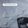 A close-up of waterproof canvas material with water droplets on a surface.
