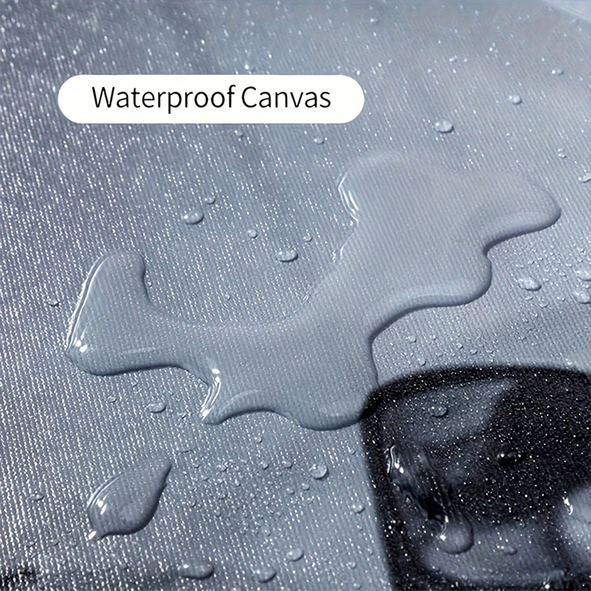 A close-up of waterproof canvas material with water droplets on a surface.