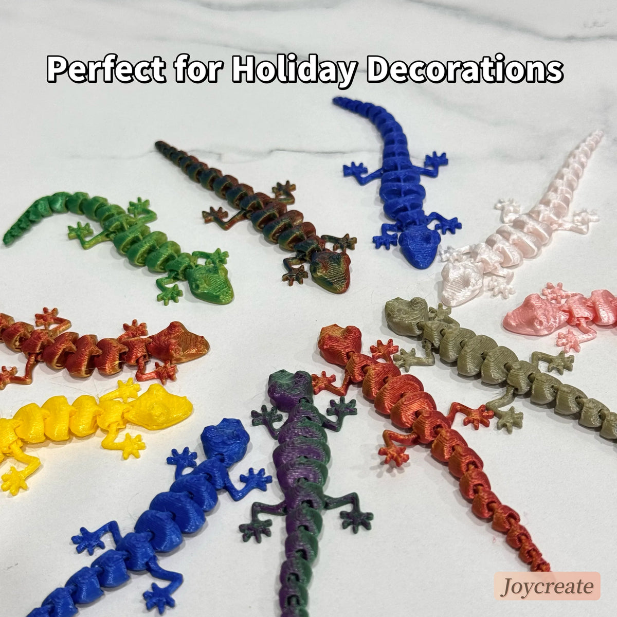 A collection of 30 3D printed articulated lizard figurines in various colors like green, blue, pink, and orange for holiday d
