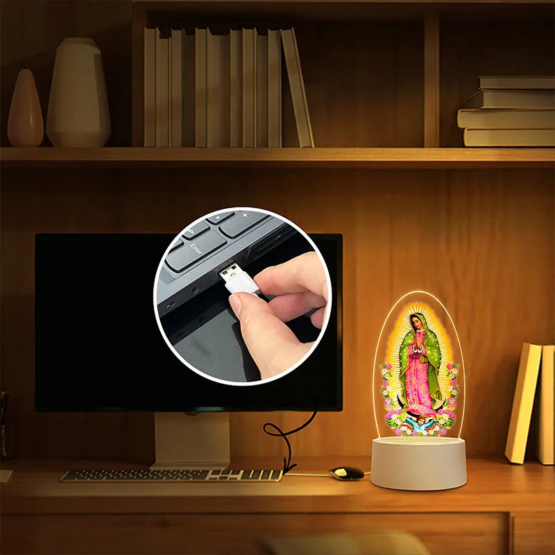 Acrylic LED night light of Our Lady of Guadalupe with USB power displayed on a wooden shelf.