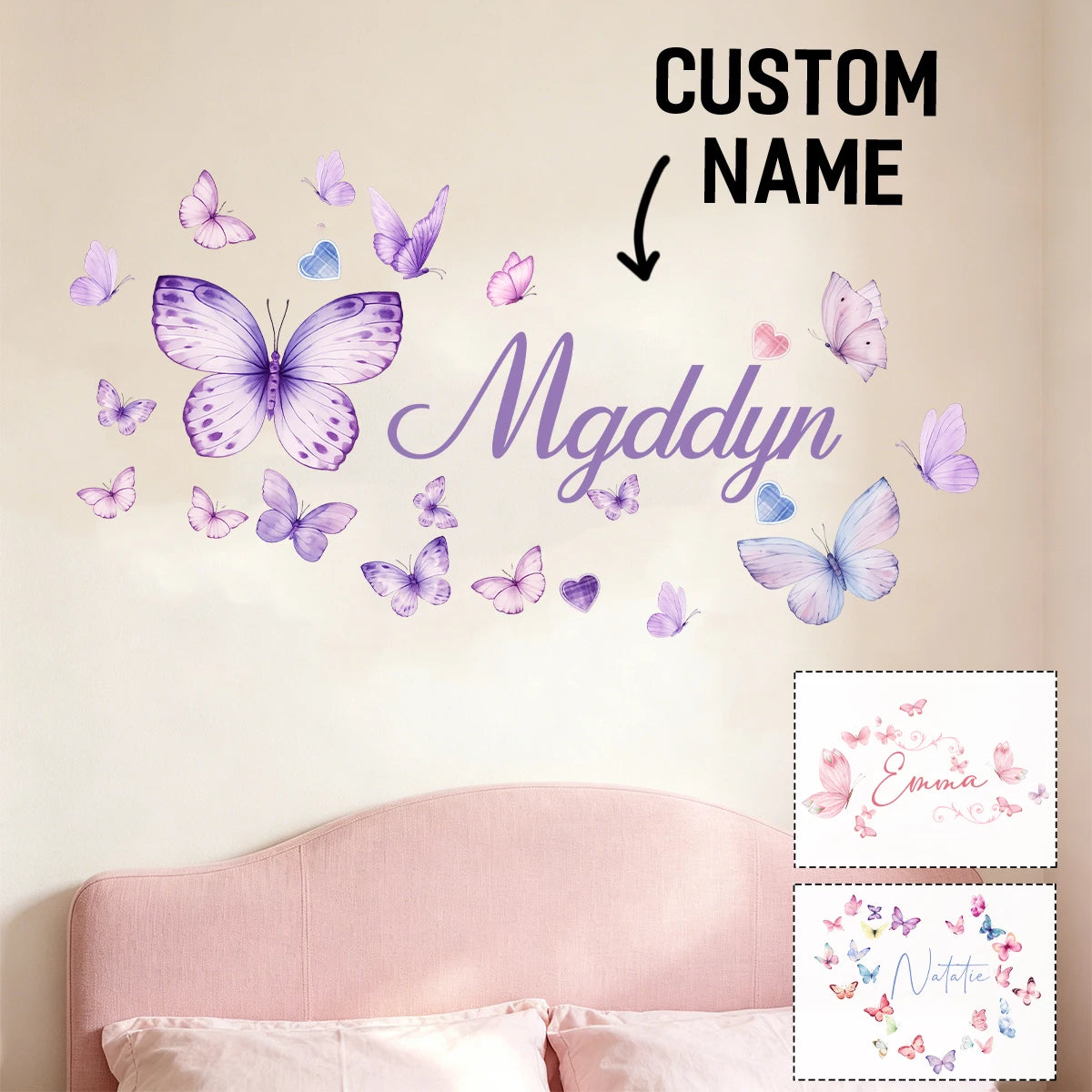 A wall decal featuring a watercolor butterfly design spelling out the name Mgddyn on a light pink wall.