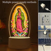 Acrylic LED night light of Our Lady of Guadalupe with a glowing halo and USB power connection.