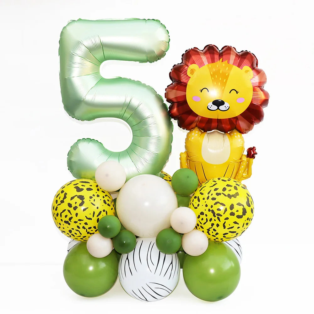 A set of foil balloons shaped like the number 5 and a lion head in yellow, orange, and green colors for a birthday party.
