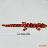 A line of 3D printed articulated lizard figurines in an orange-brown color displayed on a white background.