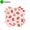 A set of pink strawberry-themed napkins is shown, featuring various strawberry designs.