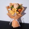 A bouquet of handmade crochet yarn flowers in shades of yellow and orange presented in a kraft paper holder.
