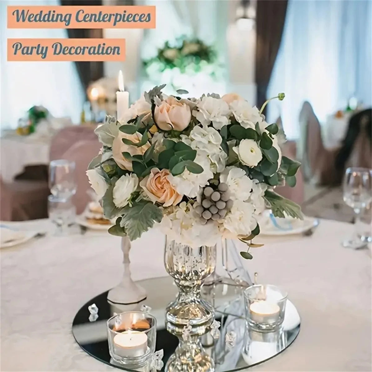 A floral centerpiece arrangement featuring roses and white flowers on a silver pedestal dish for wedding party decor.