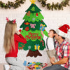 Una mujer y un niño decorando un gran árbol de Navidad de fieltro con adornos.