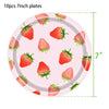 Pink plates decorated with strawberry patterns for a party supplies kit
