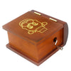 A classic wooden hand-crank music box with carved details, featuring a warm brown finish and brass accents.