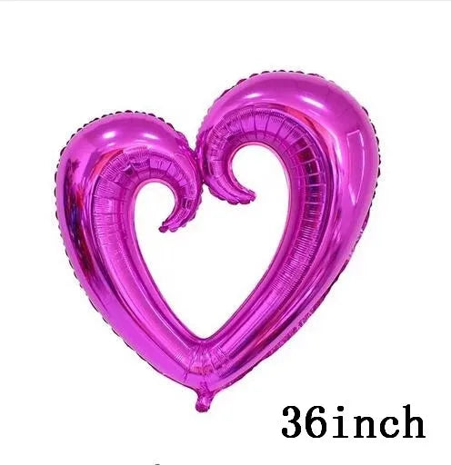 Un globo de lámina rosa en forma de corazón brillante.