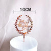 Rose gold acrylic happy birthday wreath cake topper on a white pedestal