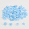 A pile of assorted light blue snap buttons, measuring 12mm and 10.5mm, for crafting.