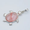 Silver pendant necklace featuring a polished pink and white agate stone shaped like an animal.
