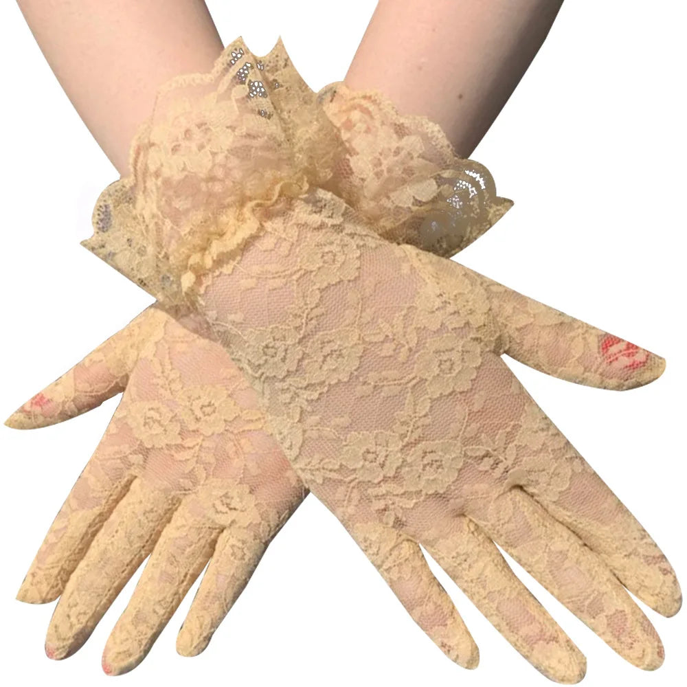 Pair of women's vintage sheer lace gloves in a pale peach color