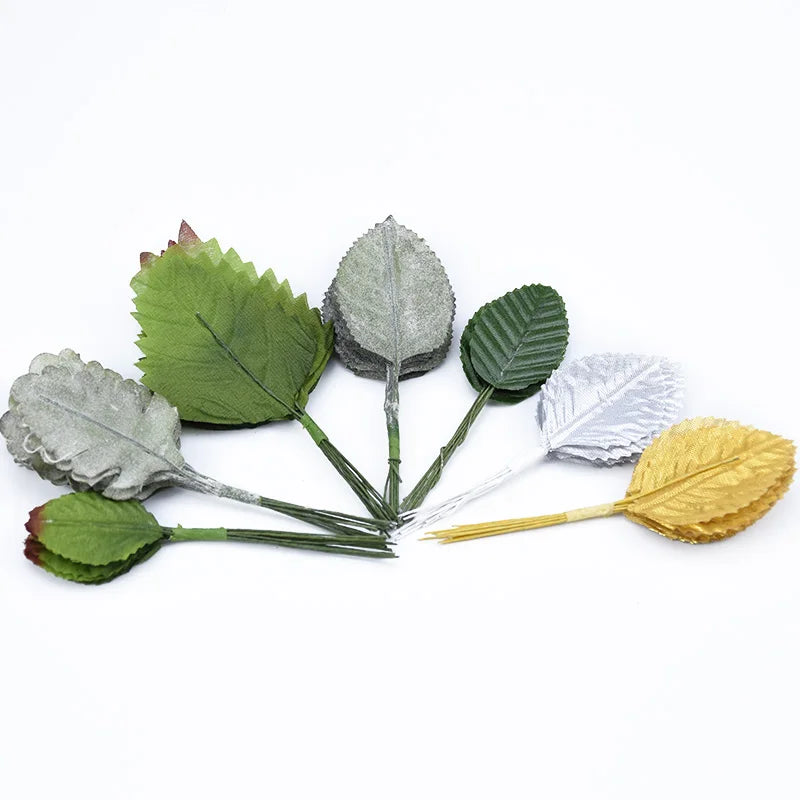 A collection of twelve silk artificial leaf stems in various shades of green, gray, and gold.