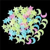 A collection of glow-in-the-dark star and crescent moon wall stickers in various pastel colors.