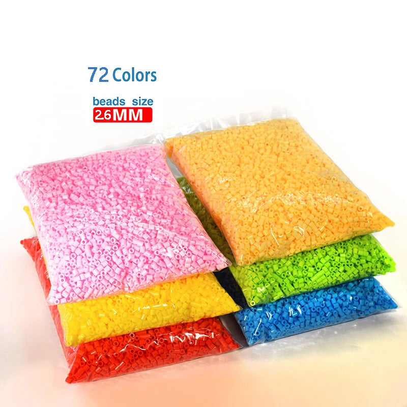 A collection of 72 colors of 2.6mm fuse beads in plastic bags, displayed in a row.