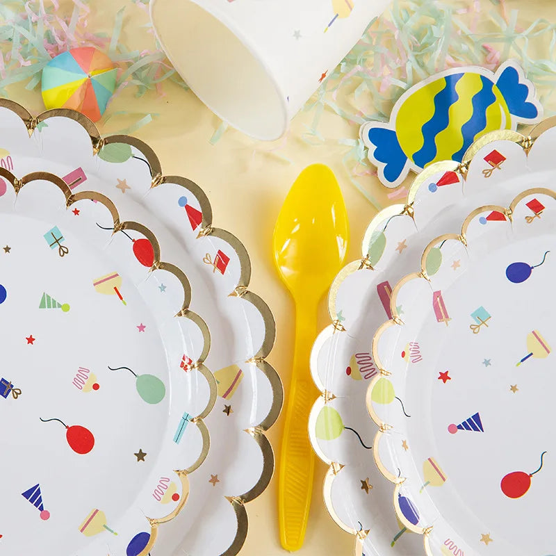 A stack of colorful cartoon-themed disposable paper plates for parties, featuring bright colors and festive designs.