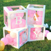 A display of pink and white balloons inside clear box frames decorated with the letter B and A