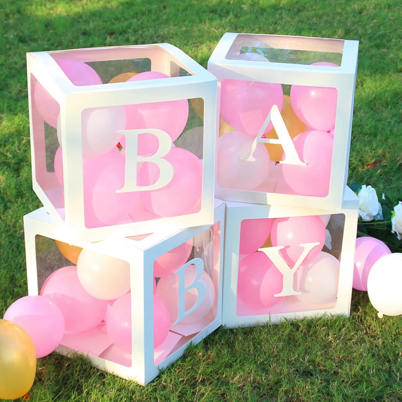 A display of pink and white balloons inside clear box frames decorated with the letter B and A