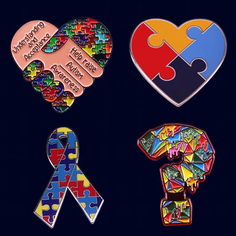 A set of puzzle pieces shaped like a heart, a ribbon, and the number 9, all in rainbow colors, used as awareness pins.