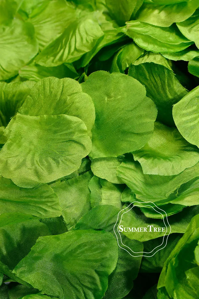 Green silk rose petals used for weddings and events
