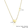 Gold-tone titanium steel heart lock key pendant necklace with a chain and a heart charm