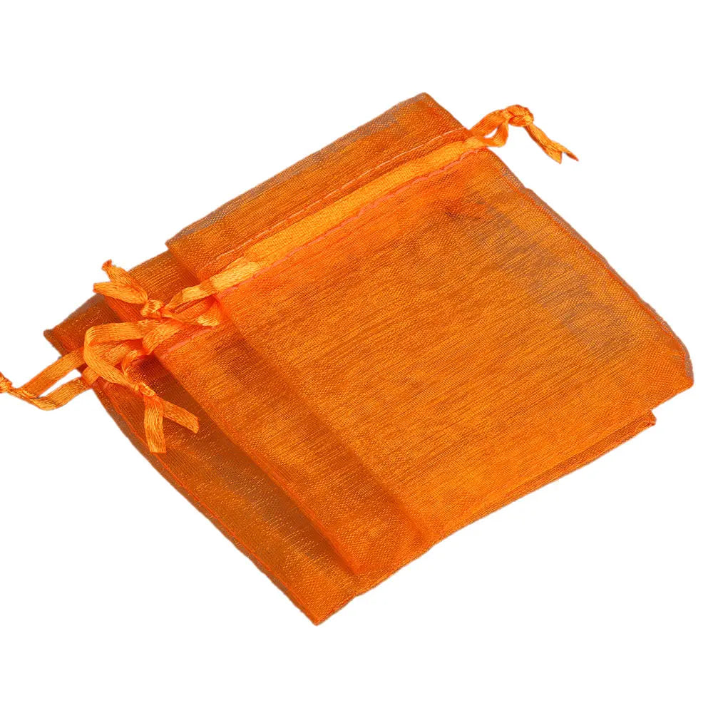 Orange organza drawstring gift pouches for jewelry, candy, or party favors