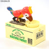 A ceramic parrot money bank featuring a bird design, colored red and yellow, sitting on a light yellow box.