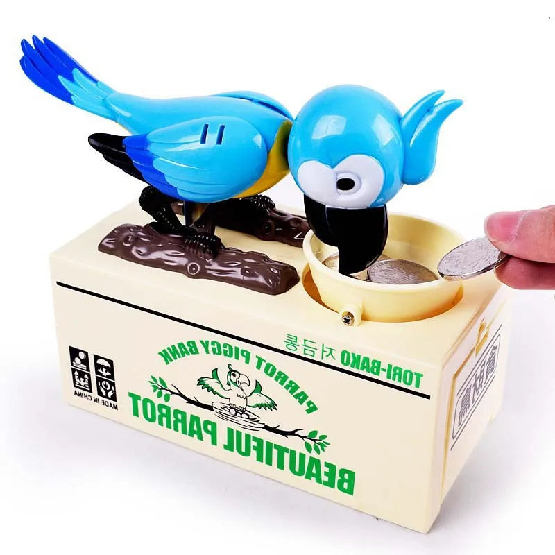 A parrot-shaped money bank featuring a blue bird design, placed on a light yellow box.