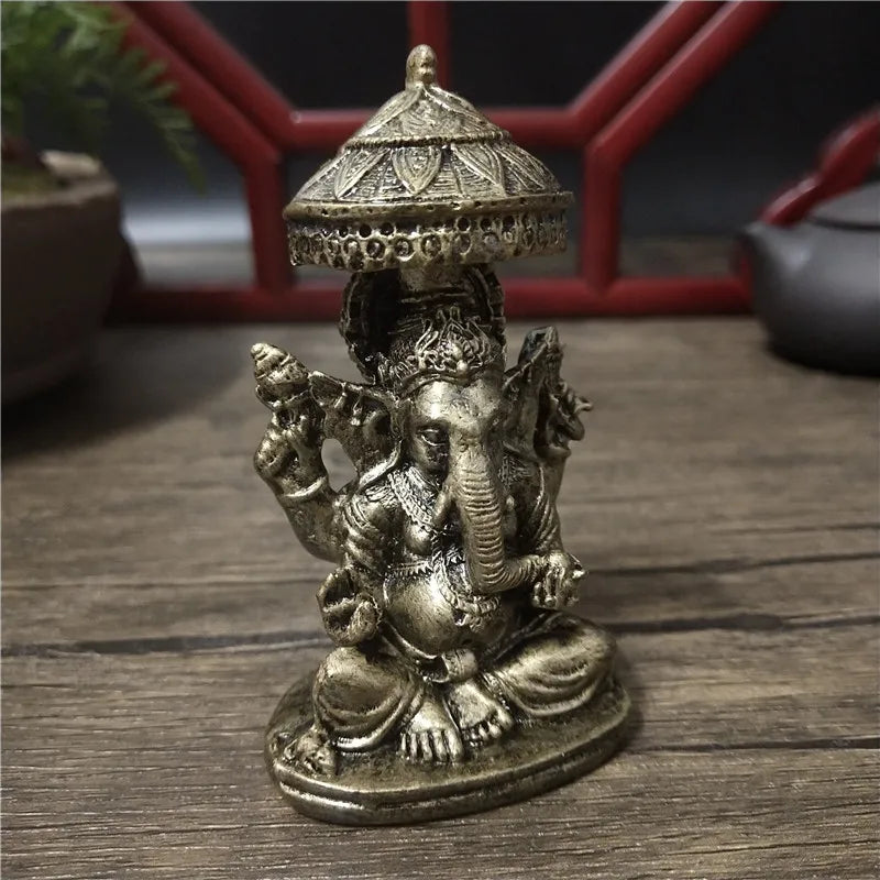 Bronze Ganesha Buddha statue with a conical crown and decorative elements for home decor