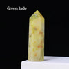 A translucent yellow-green crystal point prism tower for meditation and home decor.