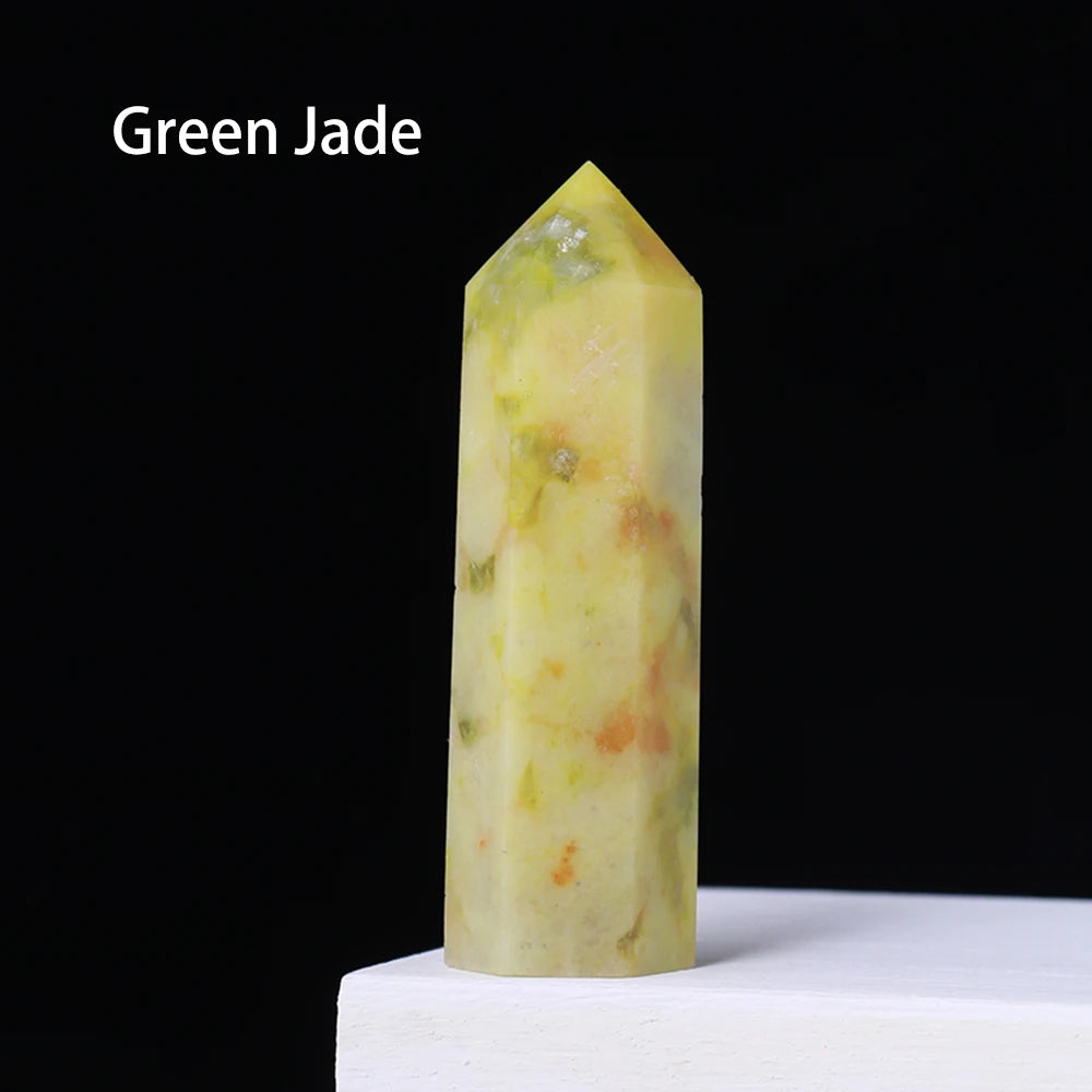 A translucent yellow-green crystal point prism tower for meditation and home decor.