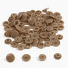 A pile of assorted tan and beige snap buttons, measuring 12mm and 10.5mm, for crafting.
