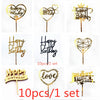 A set of ten gold acrylic love happy birthday cake toppers featuring various designs and text