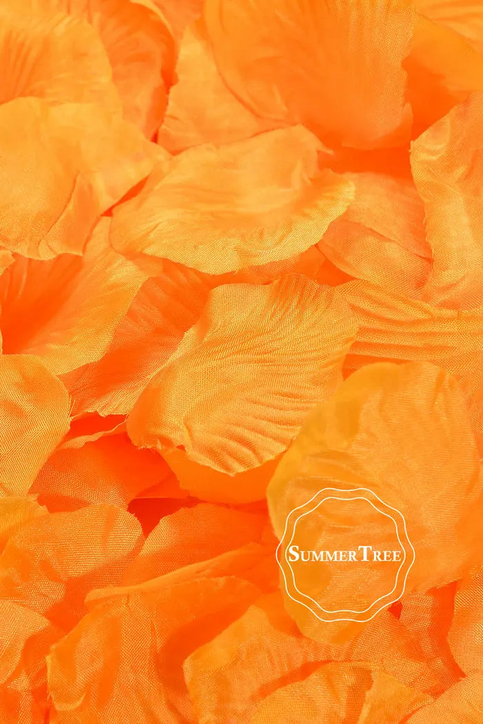 A close-up of vibrant orange silk rose petals used for weddings and events.