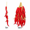 A bundle of five bright red, lifelike artificial fruits or vegetables on a natural twine hanger.