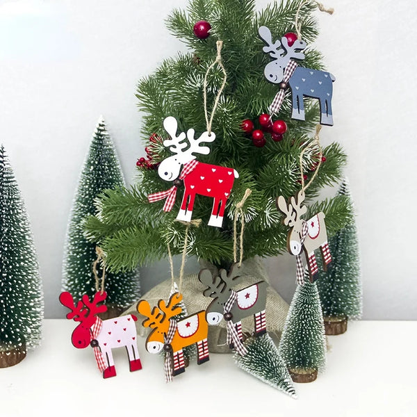 Hand-painted wooden deer Christmas ornaments hanging on a green fir tree.