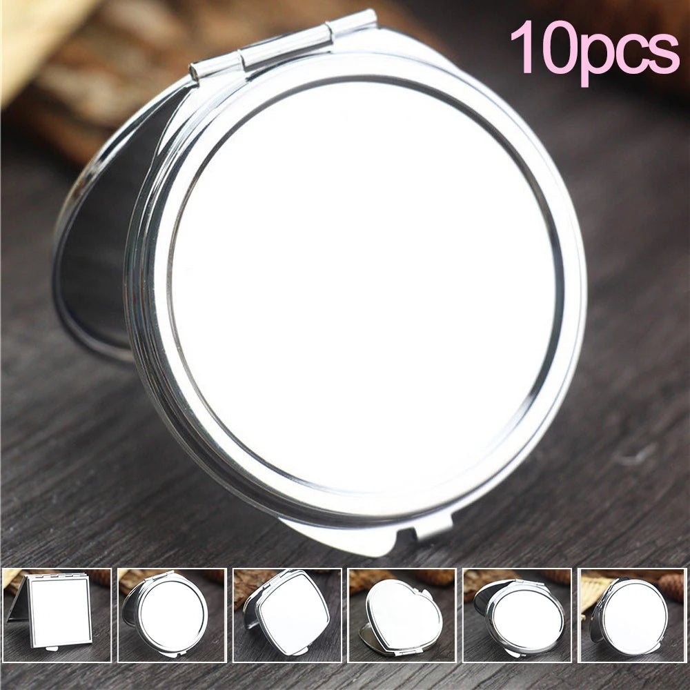 A set of ten mini double-sided folding makeup mirrors shown in various angles on a dark surface.