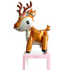 A foil balloon decoration set shaped like a deer with antlers and a golden body.
