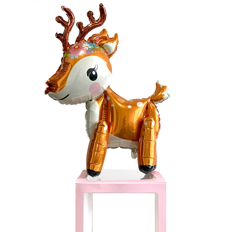 A foil balloon decoration set shaped like a deer with antlers and a golden body.