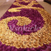 A vibrant purple and gold silk rose petal design covering a floor or surface.