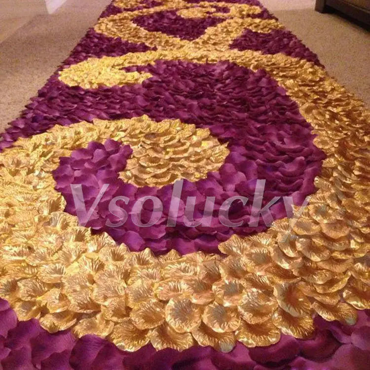 A vibrant purple and gold silk rose petal design covering a floor or surface.