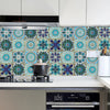 A kitchen backsplash featuring colorful mandala tile stickers with blue, teal, and purple patterns.