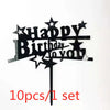 Black acrylic happy birthday cake toppers with stars and text on a stick