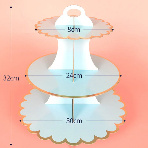 A three-tier cardboard cupcake stand with a light blue color and gold accents, showing its dimensions.