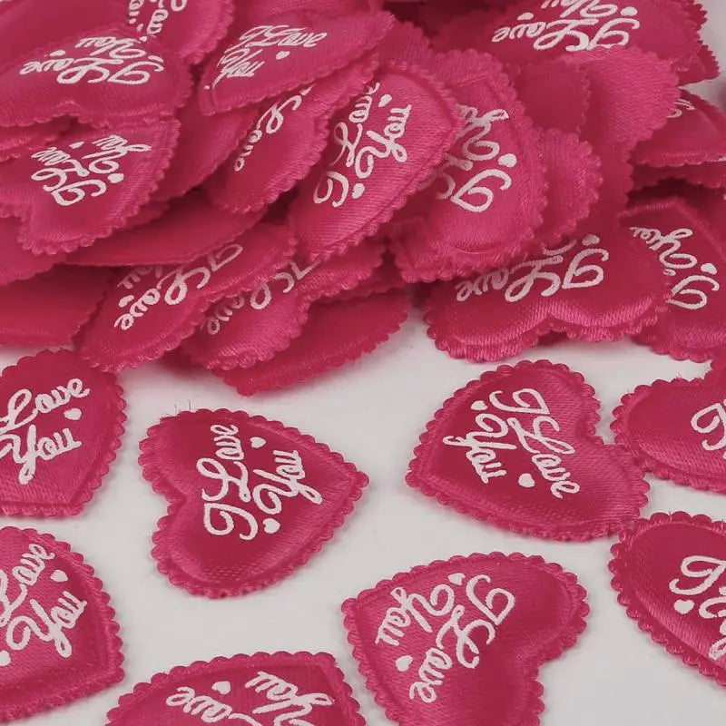 Pink heart-shaped sponge confetti scattered on a white surface for weddings and celebrations