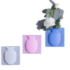 A set of flexible self-adhesive wall flower vases in various shades of blue and pink.