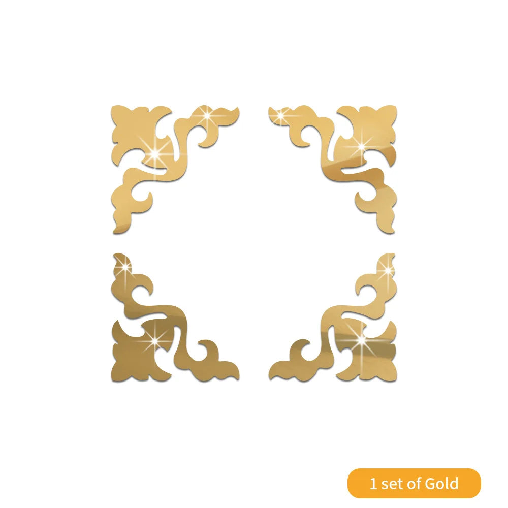 A set of four decorative gold acrylic mirror wall stickers in a swirling design.